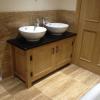 Twin oak vanity unit with black granite & seramic sinks